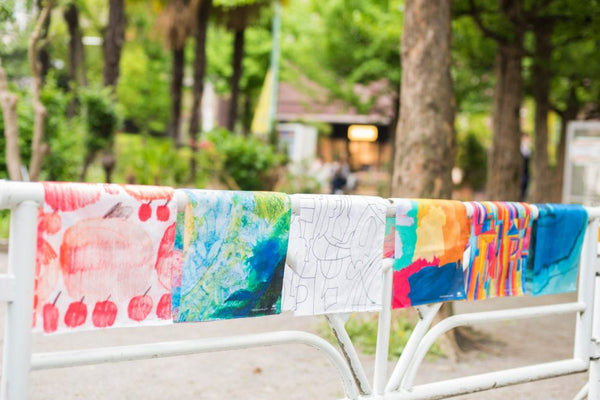 「TOMORROWLAND × MUKU」ハンカチをキャンバスに、商品プロデュース